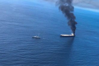 Smoke rising after a fire broke out on a Panama-registered oil tanker.
