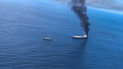 Smoke rising after a fire broke out on a Panama-registered oil tanker.