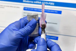 A nurse prepares a shot during a study of a possible COVID-19 vaccine developed by the National Institutes of Health and Moderna, Binghamton, N.Y., July 27, 2020.