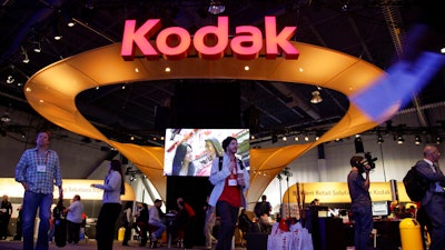 Buyers and industry affiliates pass by the Kodak exhibit at the 2012 International CES trade show in Las Vegas.