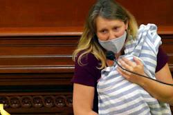 Assemblywoman Buffy Wicks, a Democrat from Oakland, addresses lawmakers while holding her one-month-old daughter Elly in her arms during the final hours of the California legislative session in Sacramento, Calif.