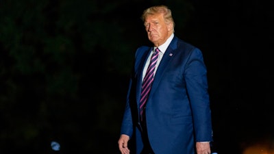 President Donald Trump walks on the South Lawn as he arrives at the White House, Monday, Sept. 14, 2020, in Washington from a trip to Phoenix.