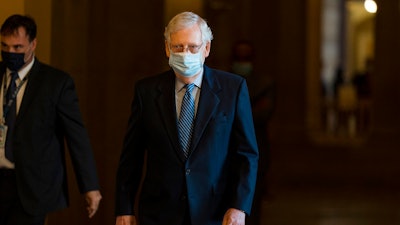 Senate Majority Leader Sen. Mitch McConnell of Ky. walks towards the Senate floor on Capitol Hill on Oct. 1 in Washington.