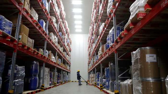 A worker moves boxes at Snowman Logistics, India's largest cold storage company in Taloja.