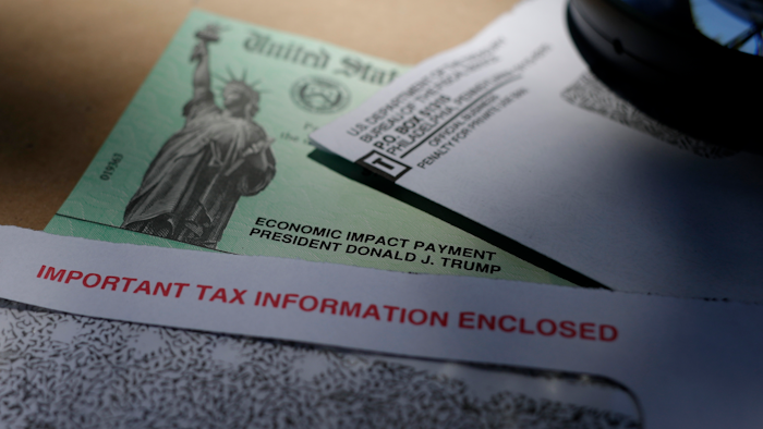 In this April 23 file photo, President Donald Trump's name is seen on a stimulus check issued by the IRS to help combat the adverse economic effects of the COVID-19 outbreak, in San Antonio.