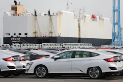 Cars are parked to be exported at Yokohama port, near Tokyo.