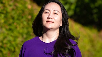 Meng Wanzhou, chief financial officer of Huawei, leaves her home to attend a court hearing in Vancouver.