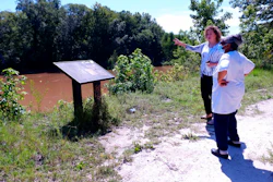 Kathy Andrews, left, speaks with Reatha Jefferson by the Great Pee Dee River Monday, Aug. 17, 2020 in Pamplico, S.C..