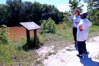 Kathy Andrews, left, speaks with Reatha Jefferson by the Great Pee Dee River Monday, Aug. 17, 2020 in Pamplico, S.C..
