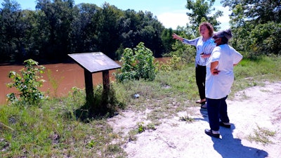 Kathy Andrews, left, speaks with Reatha Jefferson by the Great Pee Dee River Monday, Aug. 17, 2020 in Pamplico, S.C..