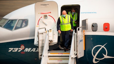 FAA chief Steve Dickson walks out of a Boeing 737 MAX, after concluding a test flight.