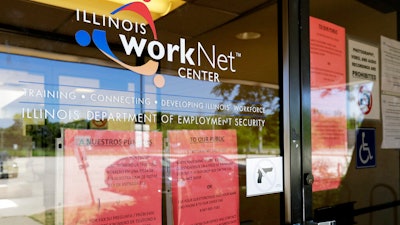 Information signs are displayed at the closed Illinois Department of Employment Security WorkNet center in Arlington Heights, Ill.