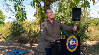 California Gov. Gavin Newsom speaks during a news conference at Sierra Orchards walnut farm in Winters, Calif.