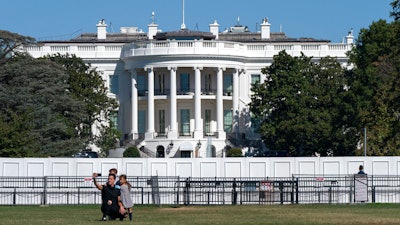 A family takes group portrait outside of the White House in Washington.