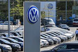 Cars are lined up at a Volkswagen car dealer in Essen, Germany.