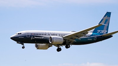 In this Monday, June 29, 2020 file photo, a Boeing 737 MAX jet heads to a landing at Boeing Field following a test flight in Seattle, USA.