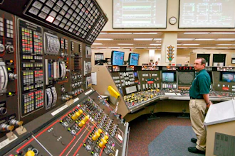In this April 12, 2005, file photo, operator Kevin Holko monitors the control room during a scheduled refueling shutdown at the Perry Nuclear Power Plant in North Perry, Ohio. A federal court docket showed that 'plea agreements' were filed Thursday, Oct. 29, 2020 for defendants Jeffrey Longstreth, a longtime political adviser, and Juan Cespedes, a lobbyist described by investigators as a 'key middleman' in a $60 million bribery case also involving ex-Ohio House Speaker Larry Householder alleged to have helped prop up this aging nuclear power plant and the Davis-Besse Nuclear Power Station in Oak Harbor, Ohio.