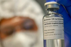 A bottle containing the drug Remdesivir is shown by a health worker at the Institute of Infectology of Kenezy Gyula Teaching Hospital of the University of Debrecen in Debrecen, Hungary, Thursday Oct. 15, 2020. The drug developed by the Budapest based Chemical Works of Gedeon Richter Plc., is administered to novel coronavirus patients in serious condition as a clinical test to stop the replication of the virus.
