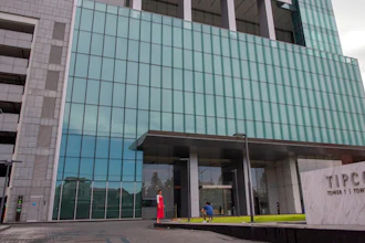 The TIPCO tower stands in Bangkok, Thailand, Wednesday, Sept. 2, 2020. One of Asia's biggest asphalt companies, Tipco Asphalt, is helping Venezuela skirt harsh U.S. sanctions by moving hundreds of millions of dollars on behalf of the state-run oil company PDVSA, according to an Associated Press investigation.