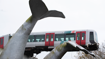 The front carriage of a metro train perched on a whale sculpture after ramming through the end of an elevated rail section, Spijkenisse, Netherlands, Nov. 2, 2020.