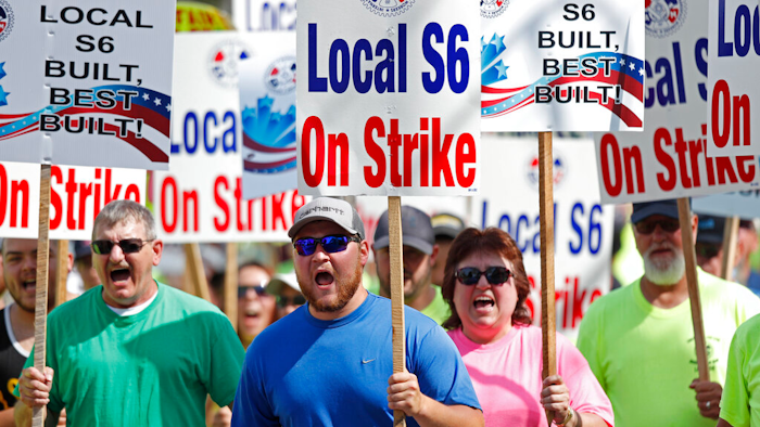 Striking Bath Iron Works shipbuilders march in solidarity.
