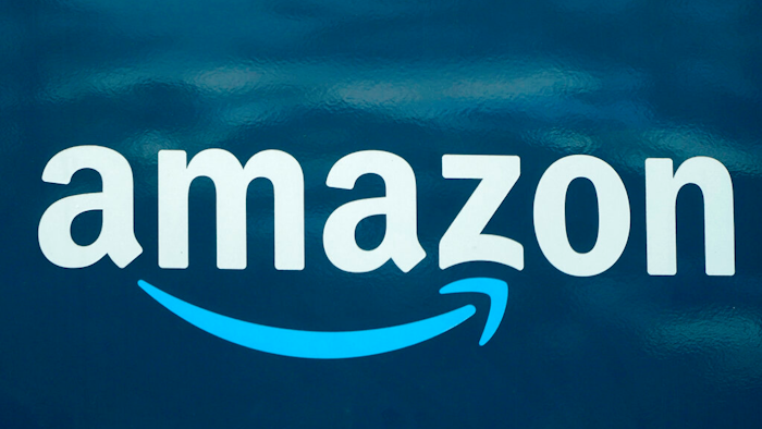 Amazon logo appears on an Amazon delivery van.