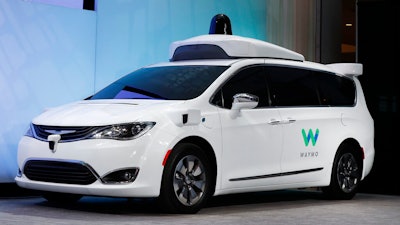 A Chrysler Pacifica hybrid outfitted with Waymo's suite of sensors and radar.