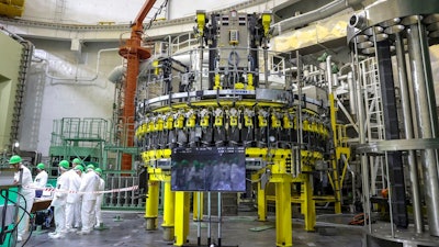 Personnel work to begin loading nuclear fuel at Belarus' first nuclear plant.