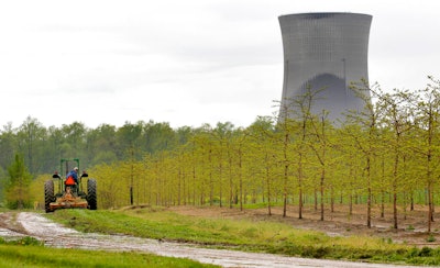 A worker is seen in the area surrounding a tree farm in North Perry, Ohio.
