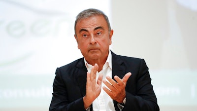 Nissan's former executive Carlos Ghosn attends a press conference.
