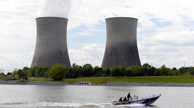 A boat travels on the Tennessee River near the Watts Bar Nuclear Plant near Spring City, Tenn.