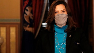 Michigan Gov. Gretchen Whitmer addresses the state during a speech in Lansing, Nov. 12, 2020.