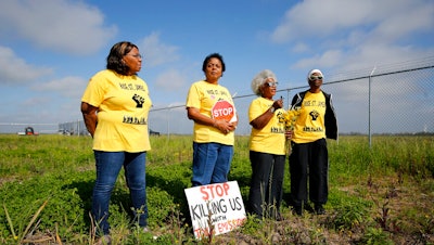 Myrtle Felton, from left, Sharon Lavigne, Gail LeBoeuf and Rita Cooper, members of RISE St. James, conduct a live stream video on property owned by Formosa in St. James Parish, La.