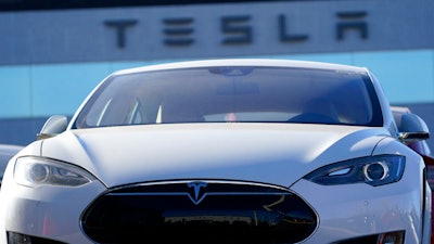 An unsold 2021 S70 sedan sits at a Tesla dealership.