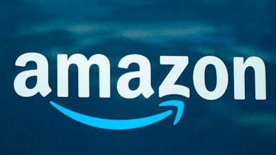 Amazon logo appears on an Amazon delivery van.