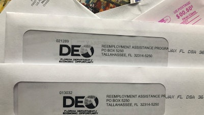 Envelopes from the Florida Department of Economic Opportunity Reemployment Assistance Program are shown in this photo from Nov. 5 in Surfside, FL.