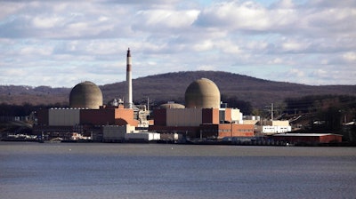 This Dec. 16, 2009, file photo, shows the Indian Point nuclear power plant in Buchanan, N.Y., as seen from across the Hudson River in Tomkins Cove, N.Y. The Nuclear Regulatory Commission's staff have approved the sale of the nuclear power plant north of New York City to a New Jersey company for dismantling, despite petitions from state and local officials to hold public hearings before taking action.