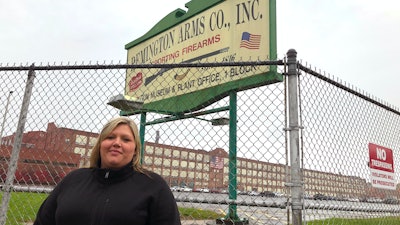 Jacquie Sweeney stands outside the Remington firearms factory in Ilion, N.Y., Oct. 20, 2020.