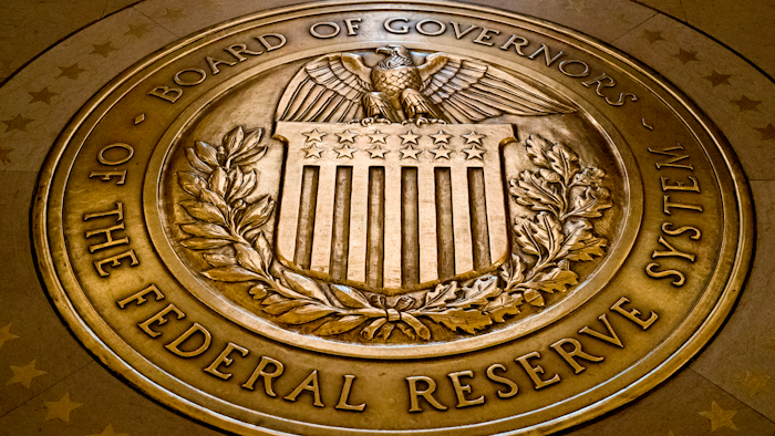 This Feb. 5, 2018 photo shows the seal of the Board of Governors of the United States Federal Reserve System in the ground at the Marriner S. Eccles Federal Reserve Board Building in Washington.