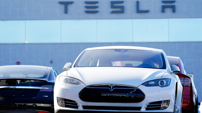 An unsold 2021 S70 sedan sits at a Tesla dealership.