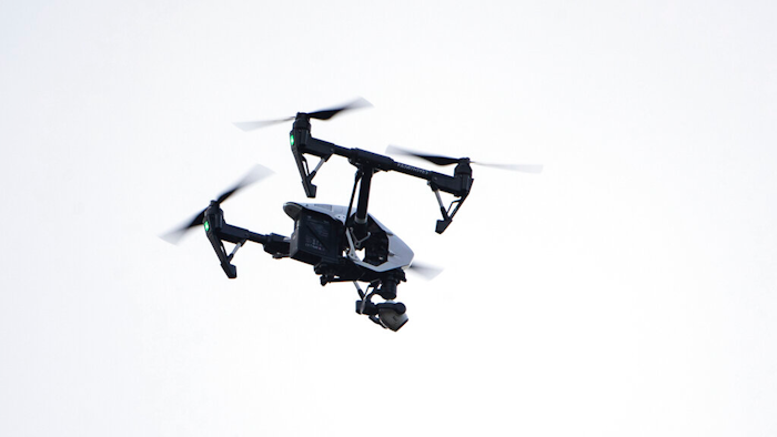 A drone flies in a residential neighborhood in Upper Moreland, Pa., Aug. 8, 2019.