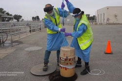 City of San José Environmental Services Department's environmental inspectors Isaac Tam and Laila Mufty deploy an autosampler into a manhole at the San José - Santa Clara Regional Wastewater Facility.