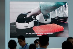 Shanghai-based testing kit company BioGerm presents a booth at a trade fair in Nanchang in eastern China's Jiangxi province on Friday, Aug. 21, 2020. BioGerm was one of three companies that gained privileged access to crucial information on the coronavirus from the Chinese Center for Disease Control and Prevention at the beginning of the outbreak, allowing them to make kits ahead of competitors. The move delayed China's response to the outbreak and caused critical shortages of kits.