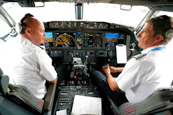 American Airlines pilots captain Pete Gamble, left, and first officer John Konstanzer in the cockpit of a Boeing 737 Max jet before taking off from Dallas-Fort Worth airport, Grapevine, Texas, Dec. 2, 2020.