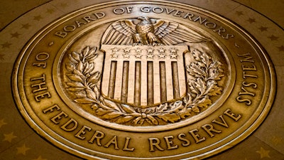 This Feb. 5, 2018 photo shows the seal of the Board of Governors of the United States Federal Reserve System in the ground at the Marriner S. Eccles Federal Reserve Board Building in Washington.