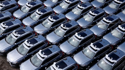 A parking lot full of Uber self-driving Volvos in Pittsburgh.