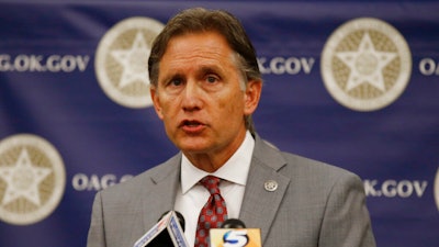 Oklahoma Attorney General Mike Hunter speaks during a news conference in Oklahoma City.