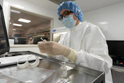A pharmacist labels syringes in a clean room where doses of COVID-19 vaccines will be handled, Mount Sinai Queens hospital in New York, Dec. 9, 2020.