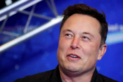 Tesla CEO Elon Musk arrives on the red carpet for the Axel Springer media award.