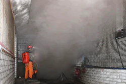 In this photo released by Xinhua News Agency, rescue workers gauge the density of carbon monoxide in the smog at the entrance of the coal mine in Yongchuan District of Chongqing, southwestern China, Friday, Dec. 4, 2020. China's state TV says more than a dozen coal miners have been killed by high levels of carbon monoxide in the country's southwest.